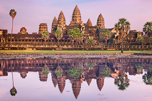 The ancient site of Angkor Wat in Cambodia at sunrise.