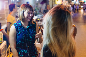 Topdeck travelers trying out Vietnamese street food in Ho-Chi-Minh City.