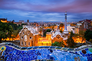 The streets of Barcelona lit up at night.