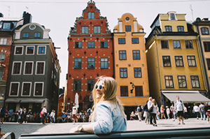 Topdeck traveler walking through Gamla Stan, one of Europe's best preserved Old Towns.