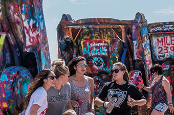 Topdeck travelers stopping by a festival on a road trip around the USA.