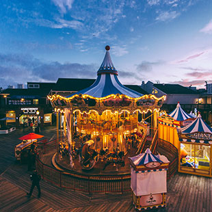 A merry-go-round in operation in San Francisco's Fisherman's Wharf.