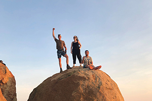 group standing on rock