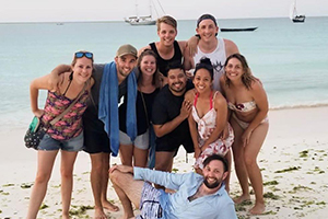 group of travellers on a beach