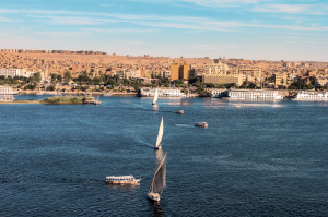 A felucca boat sailing down the Nile River. 