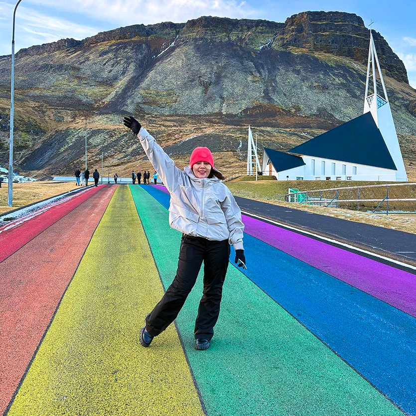 A Topdeck traveller posing for a picture on the Rainbow Field.