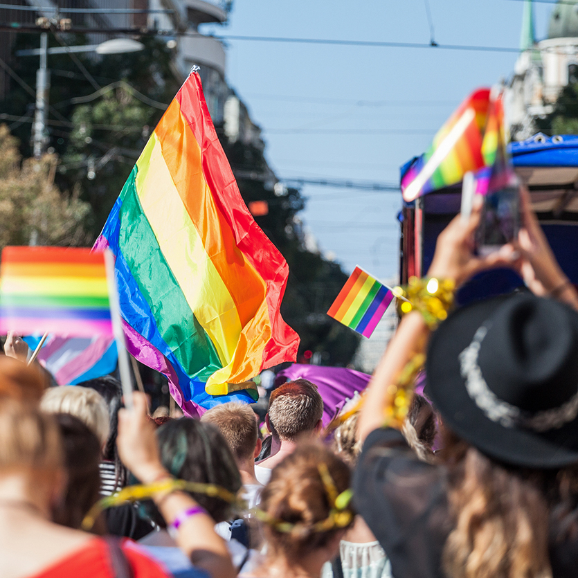 LGBTQ Flags fly during a pride march.