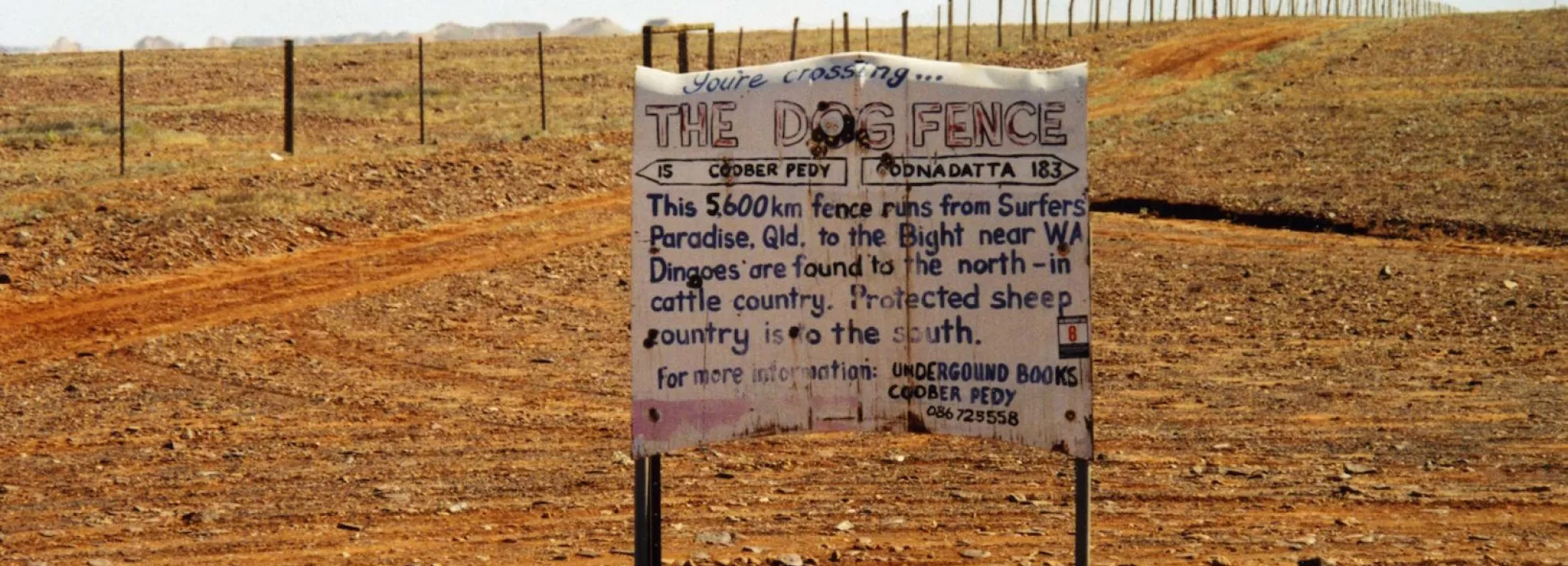 A road sign in Western Australia indicating that 'you're crossing The Dog Fence'