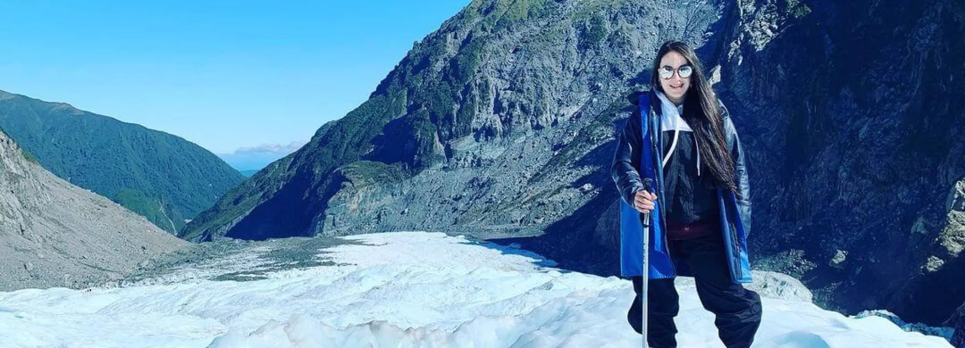 A woman standing in Fox Glacier, New Zealand South Island