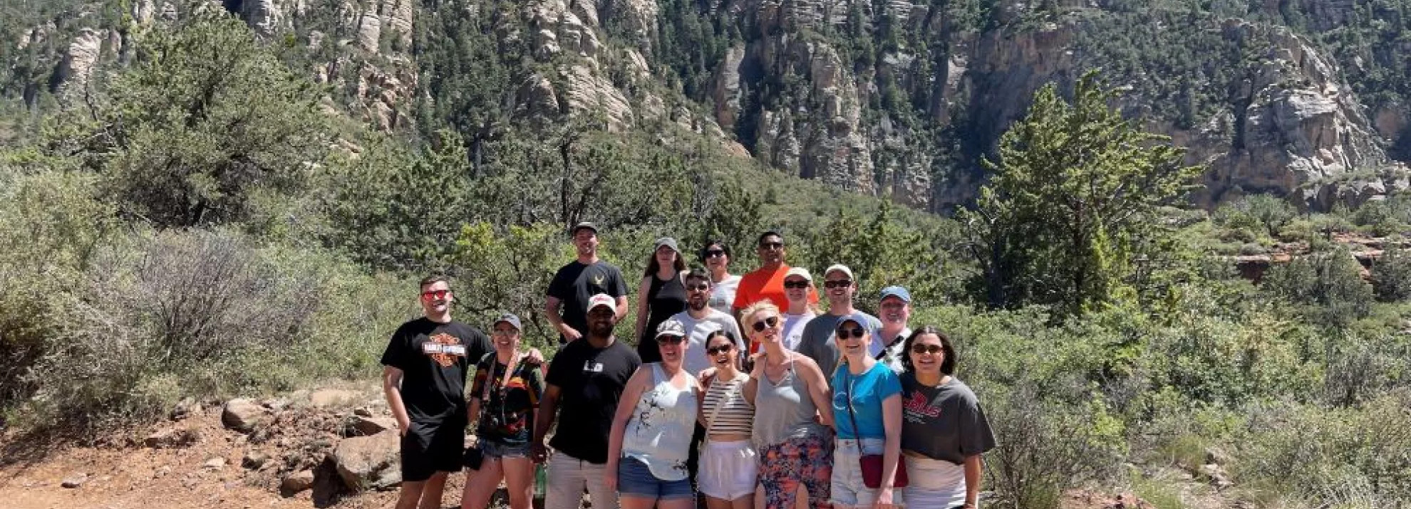 group photo of topdeckers on a hike in the mountains in the US