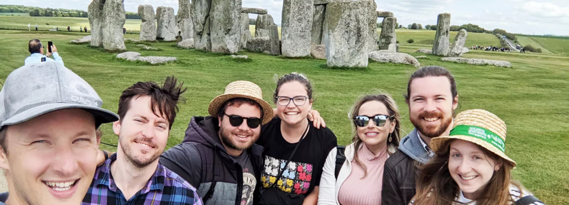 A group of Topdeckers in front of Stonehenge