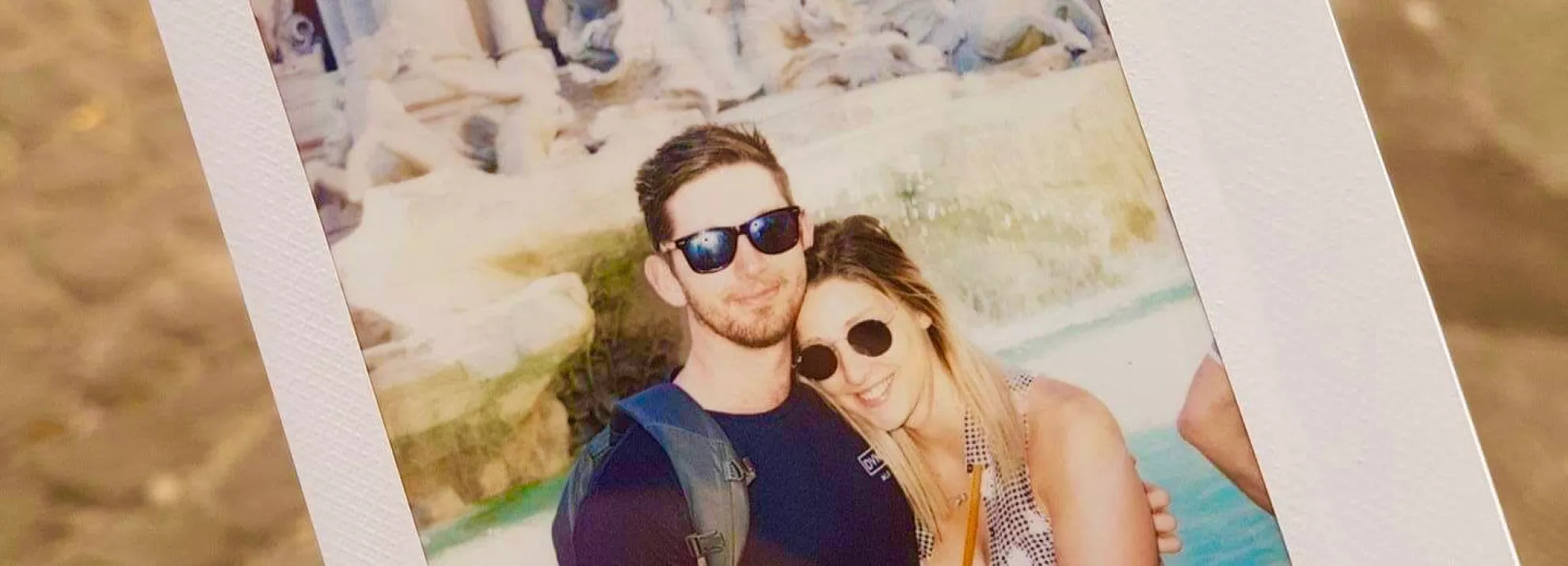 picture of a photograph of a man and woman couple embracing in front of the Trevi Fountain