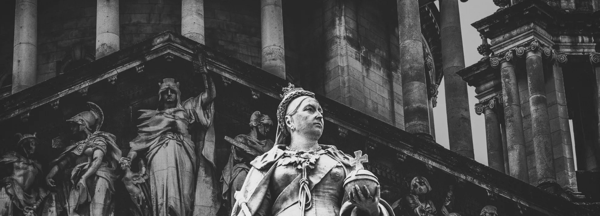 Statues of women by a temple