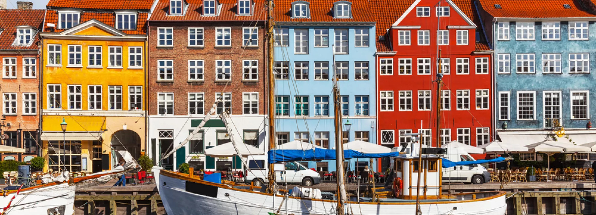 Colorful terraced houses in Copenhagen, with the Øresund in front