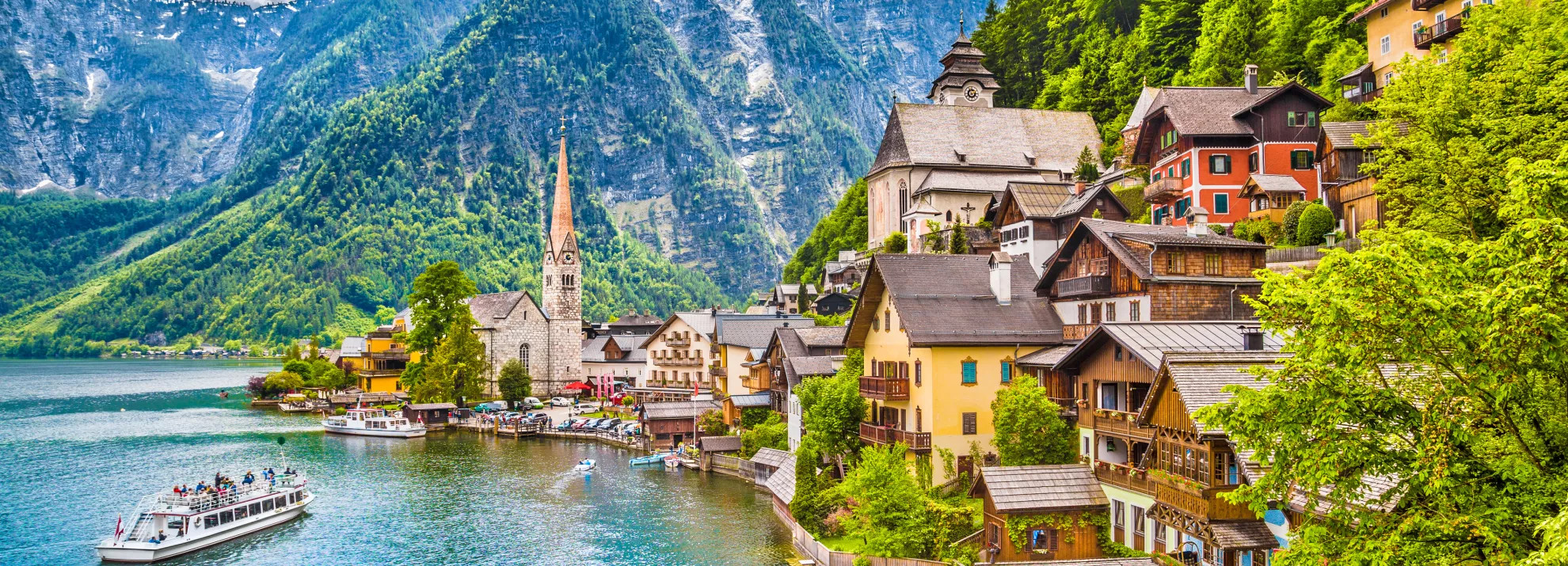 Mountains and houses by a body of water in Austria
