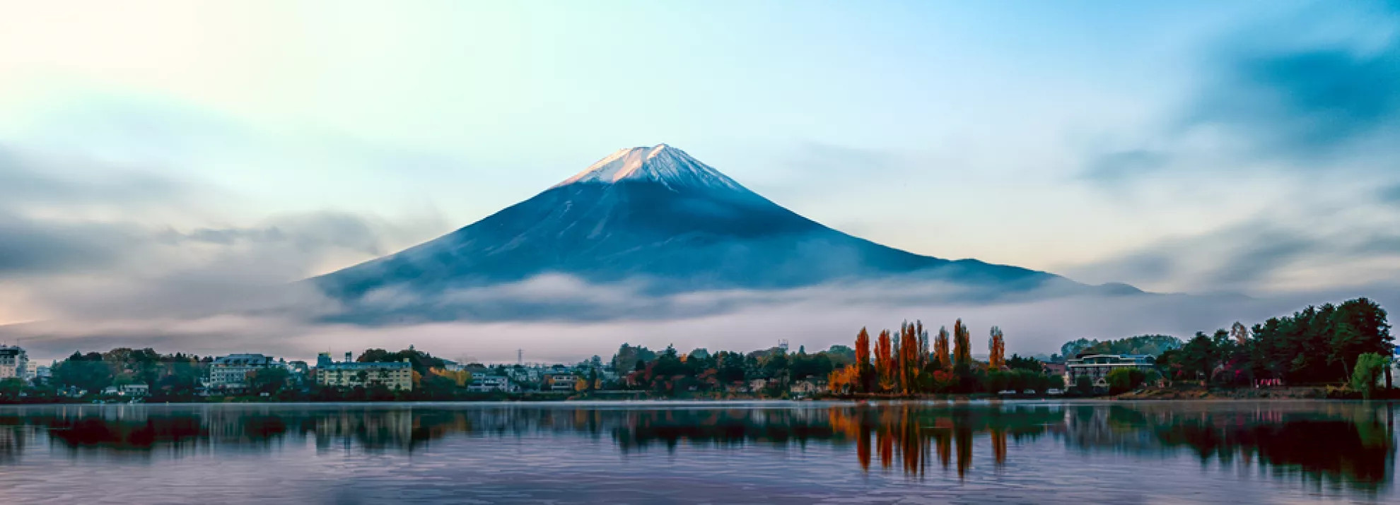 A Japanese mountain with the sea below it 