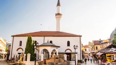 Murat Pasha Mosque with it’s white walls and tower located within the Old Bazaar of Skopje.