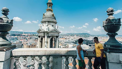 Two men looking out over Budapest from the top of Saint Peter’s Basilica