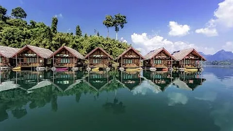 Floating bungalows in a line on Cheow Lan Lake in Khao Sok National Park