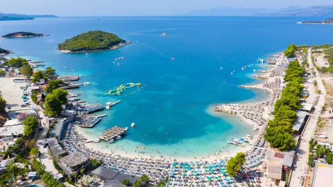 Turquoise coastline and white sand of Ksamil Beach in Albania.