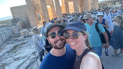 Two people smiling taking a selfie at The Acropolis