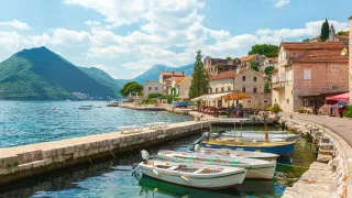 Wooden boats docked in the coastal town of Perast located on the Bay of Kotor in Montenegro.
