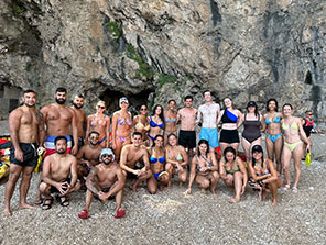 A Topdeck Travel group posing for a group photo before swimming.