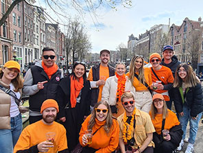 Topdeckers posing for a group photo during their trip to Amsterdam.