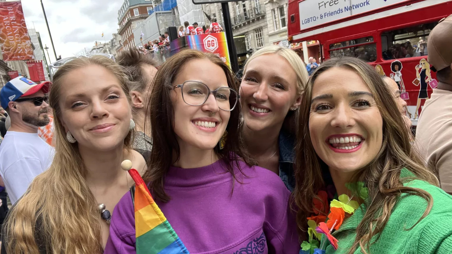 4 people smiling for a group picture at London pride 2025