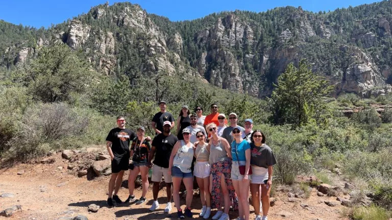 group photo of topdeckers on a hike in the mountains in the US