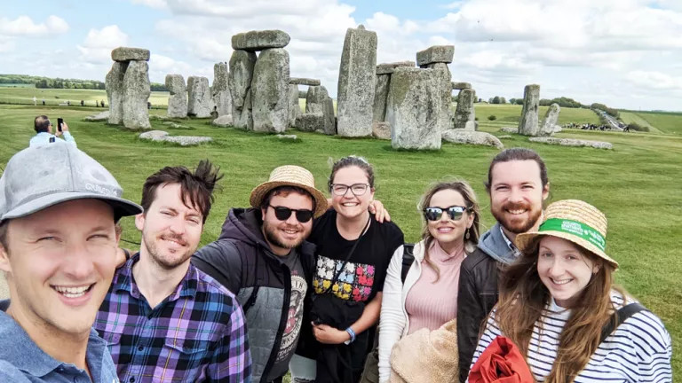 A group of Topdeckers in front of Stonehenge