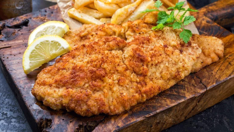 A plate of chicken schnitzel 