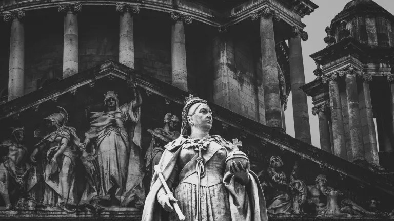 Statues of women by a temple