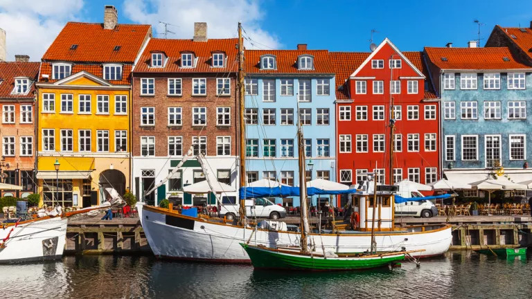 Colorful terraced houses in Copenhagen, with the Øresund in front