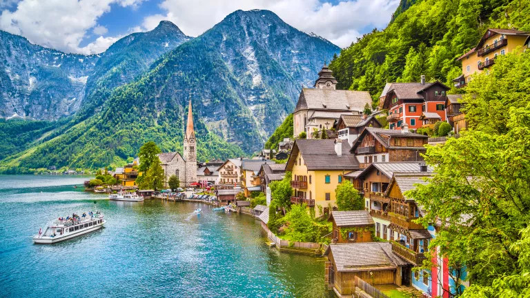 Mountains and houses by a body of water in Austria