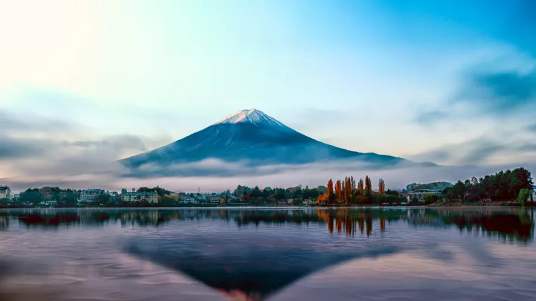A Japanese mountain with the sea below it 