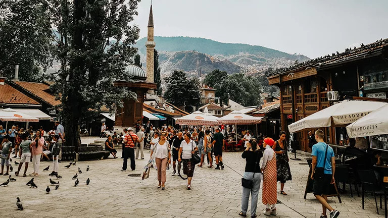 People walking through the old town bazaar of Sarajevo.