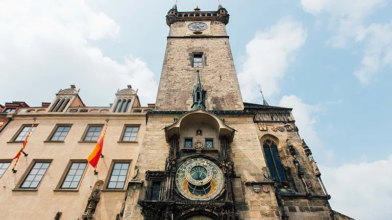 Stone clock tower of the Old Town Hall in Prague.