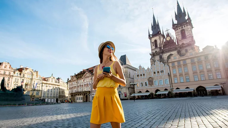 A woman looking around the Old Town Square of Prague