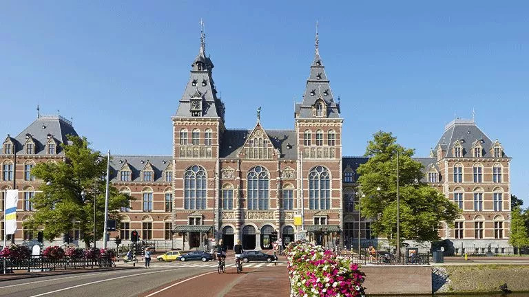 Grand building with large towers known as Rijksmuseum in Amsterdam.