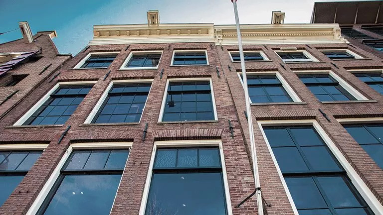 The brick walls and windows of Anne Frank’s house in Amsterdam.