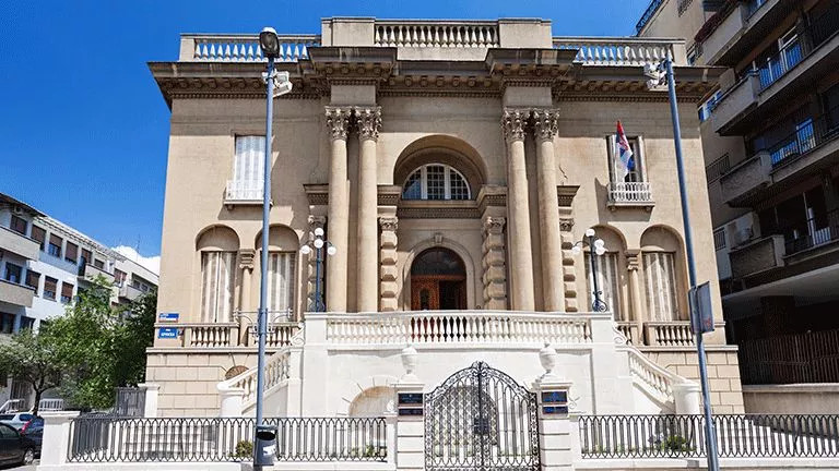 Building with four large pillars, known as the the Nikola Tesla Museum in Belgrade.