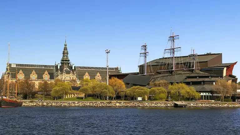 Building with the masts of a ship standing out from the roof.