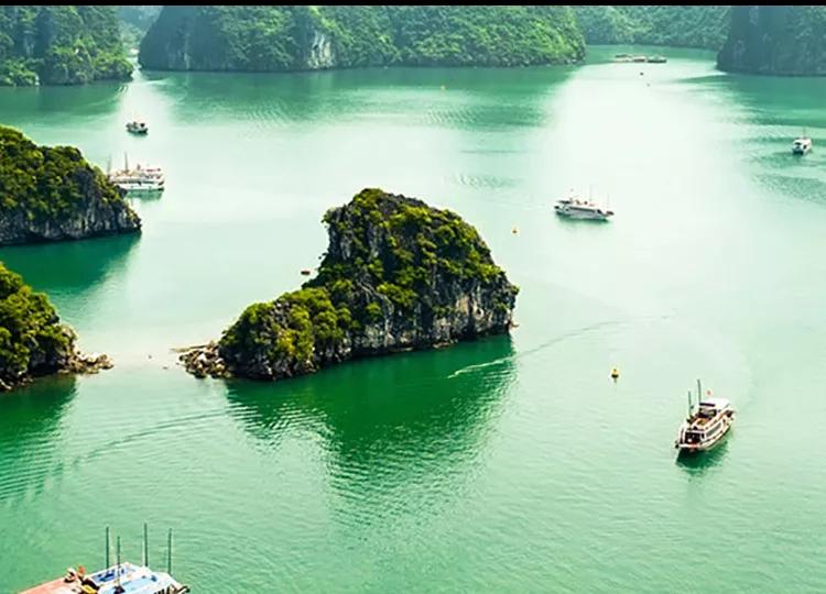 A Boat sails amidst the scenic Hanoi Bay in Vietnam