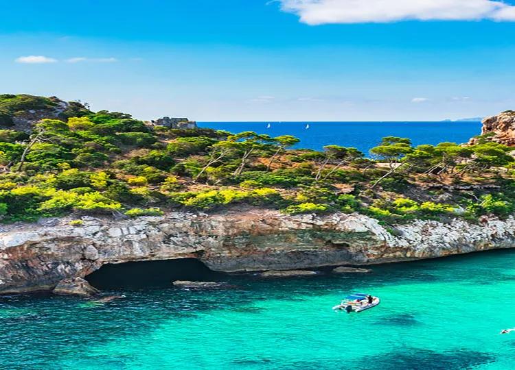 Boat cruising around a Mediterranean island.