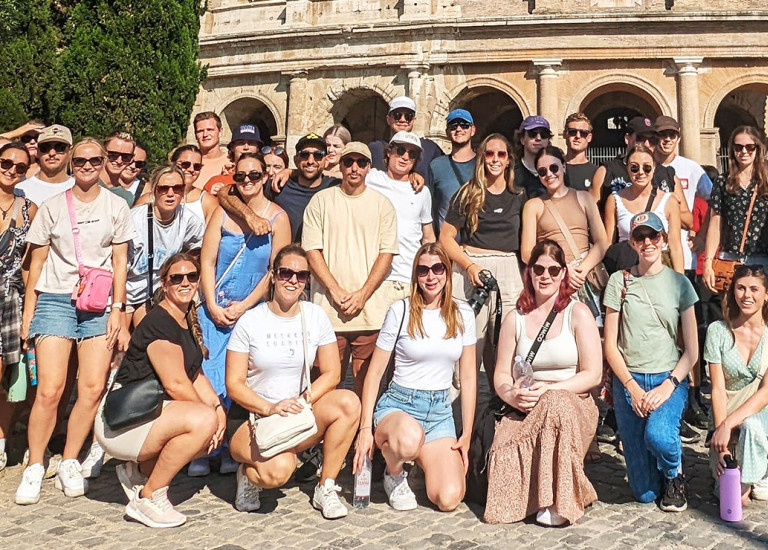 Topdeck Travelers smiling and posing for a photo during a tour of Europe.