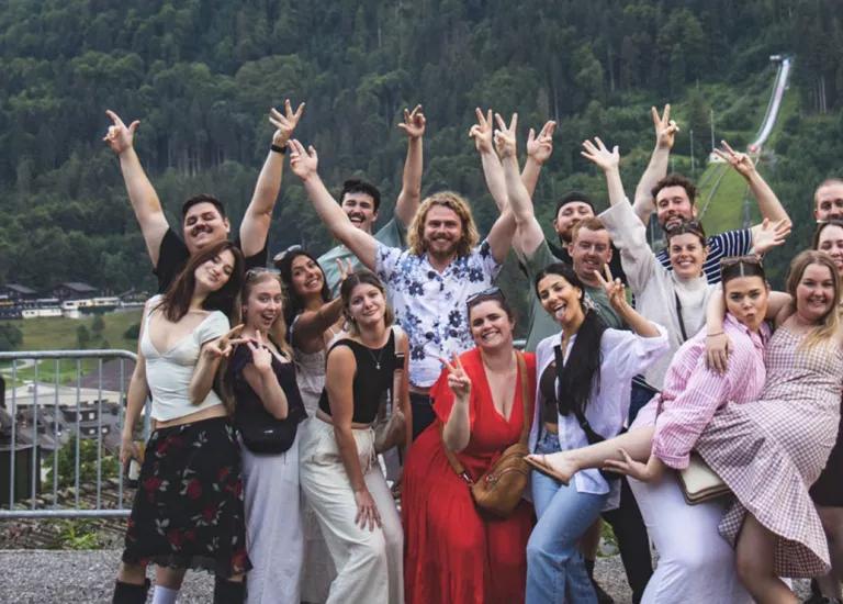 Topdeck travelers posing for a group photo together while on a trip through Europe.