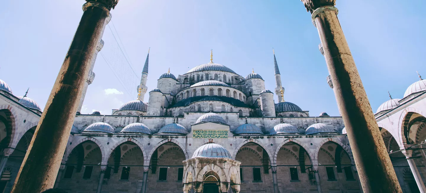 White building with blue domes and tall towers knowb as Istanbul’s Blue Mosque.