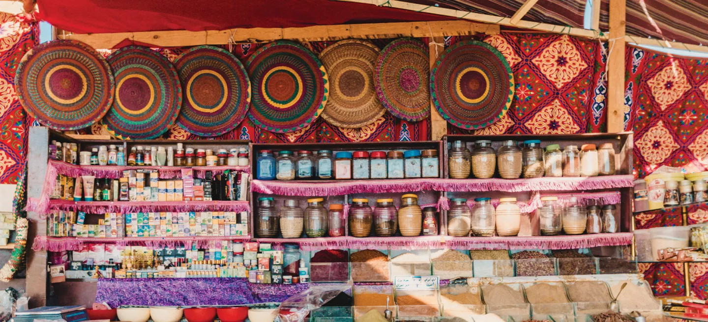 Spices and other jarred products on display in a souk in Marrakech, Morocco.