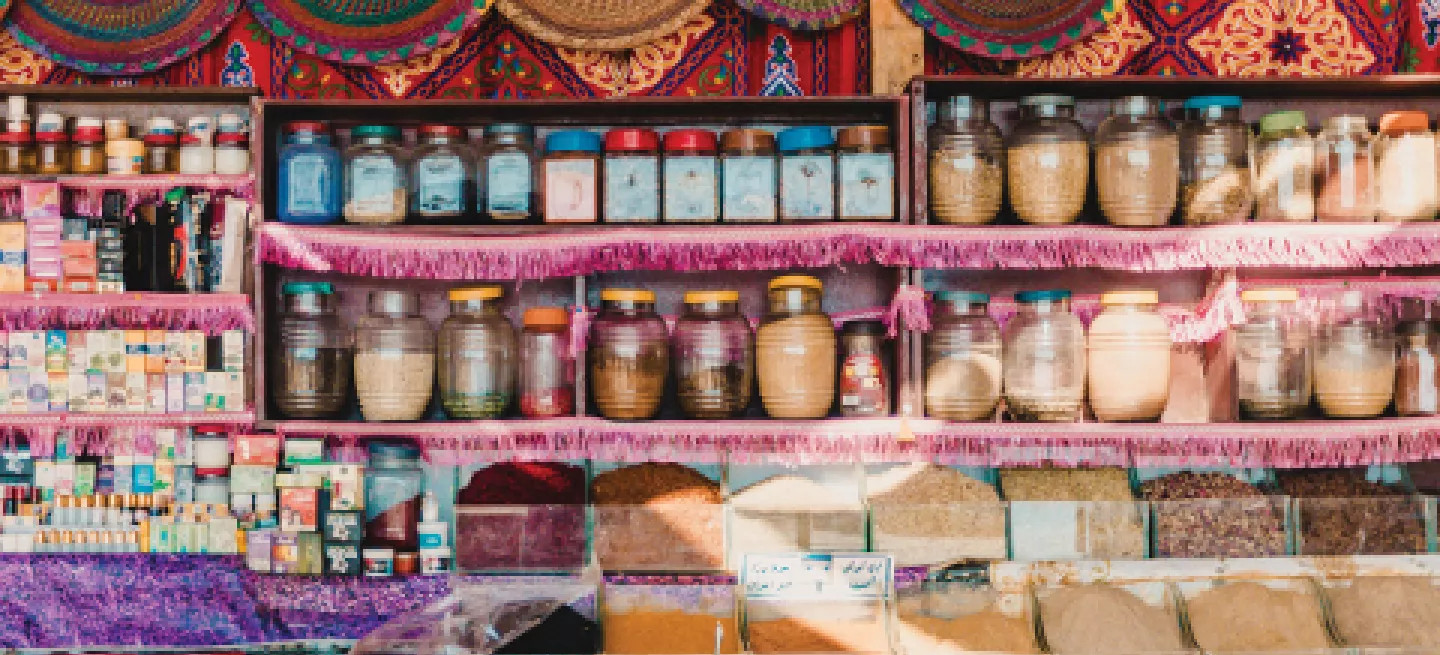 Spices and other jarred products on display in a souk in Marrakech, Morocco.